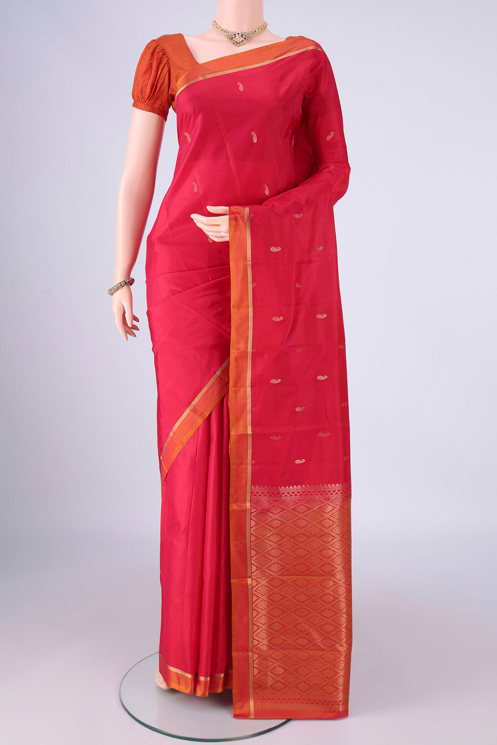Red Nangavalli Silk [ Salem ] Saree with Zari Butta on the body and Zari Border.  displayed on a mannequin