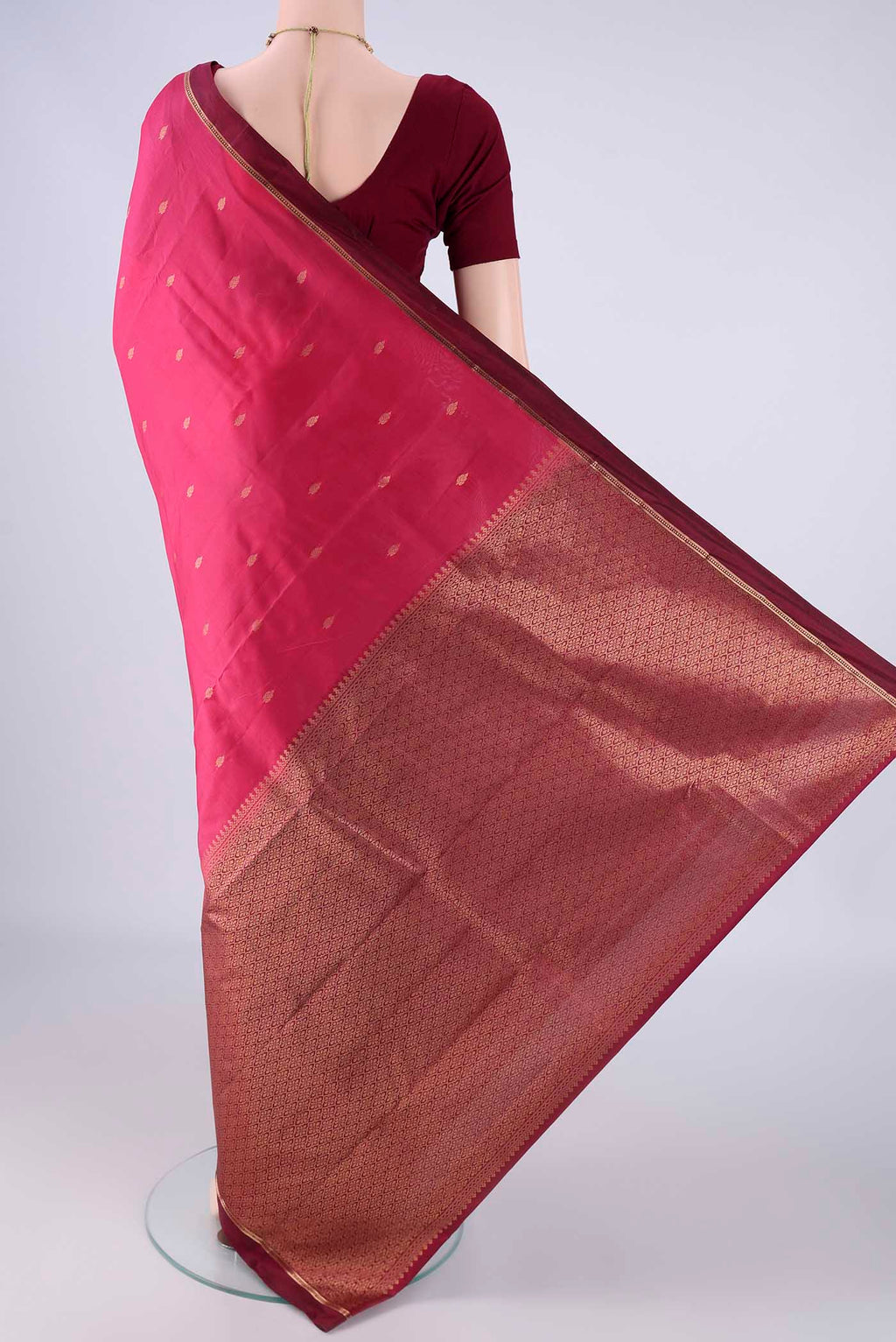 Flat view of Pink Kanjivaram Silk Saree with Zari Butta on the body and Zari Border. 