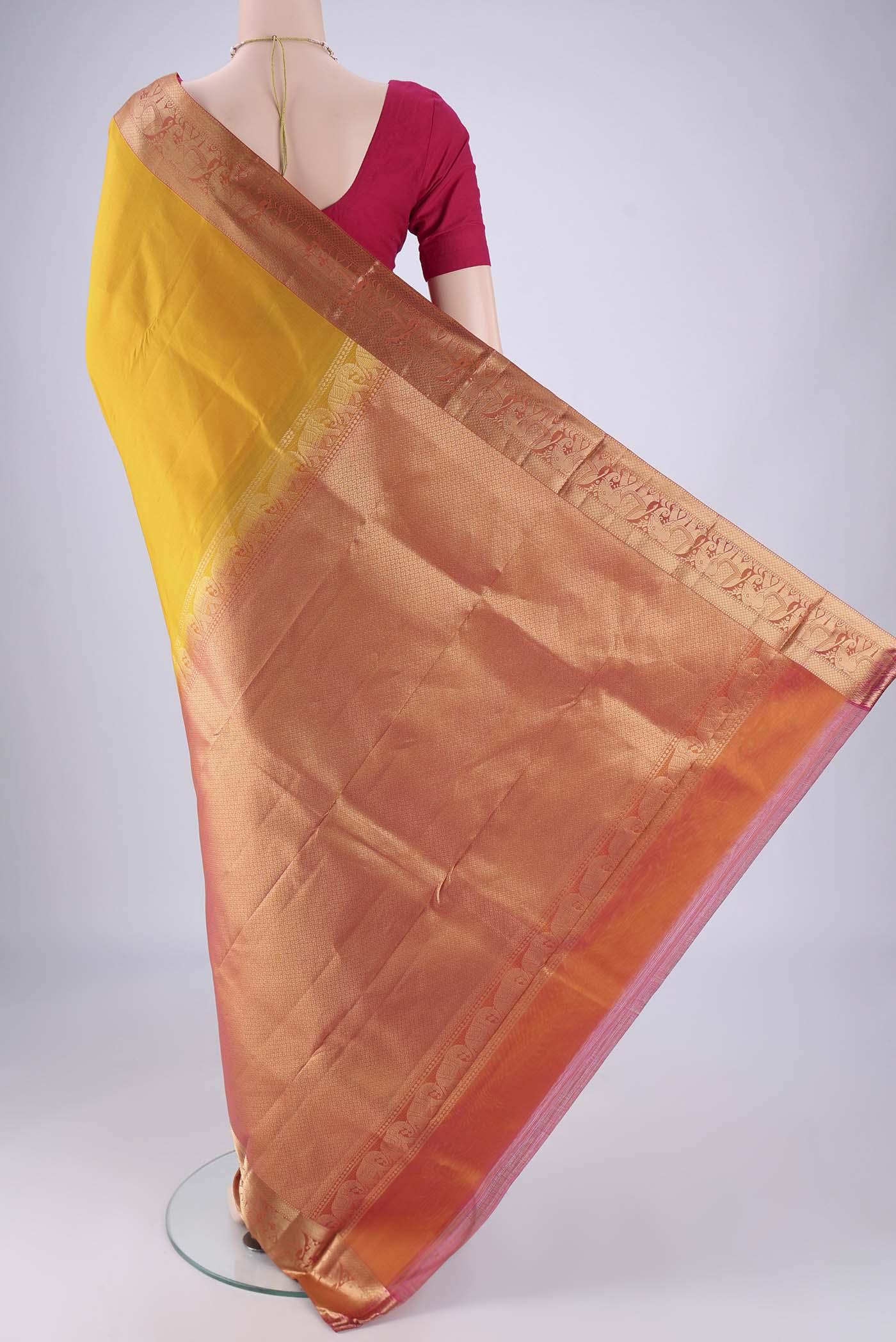 Flat view of Mustard Kanjivaram Silk Saree with Plain Body and Zari Border. 