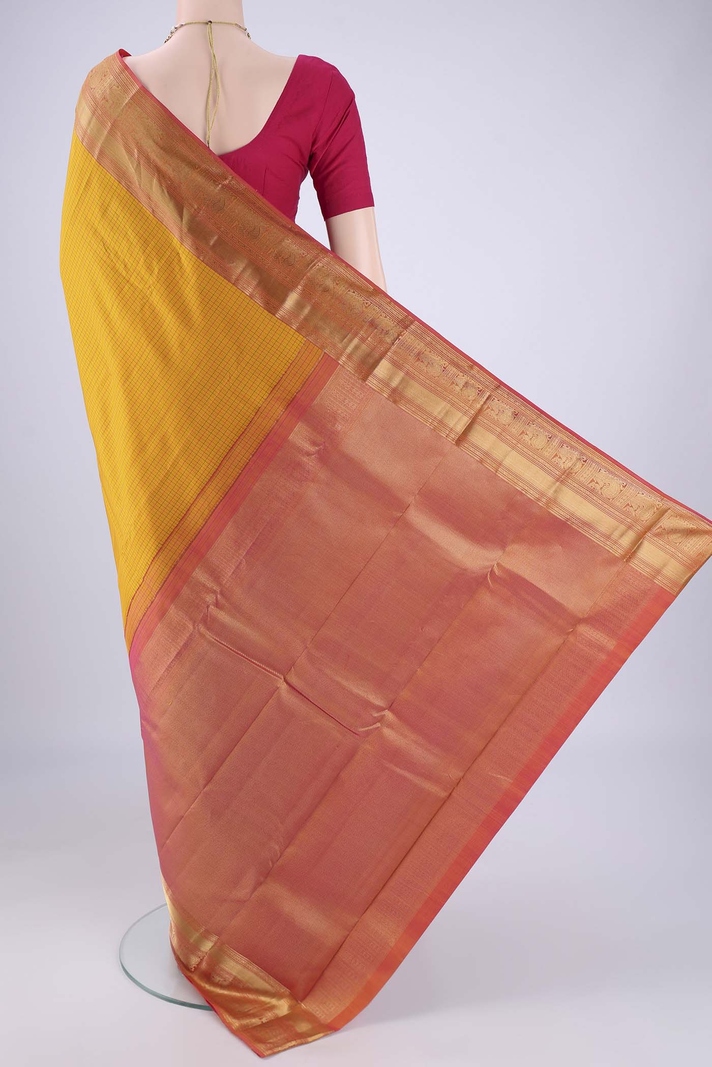 Flat view of Mustard Kanchipuram Silk Saree with Checked design on the body and Zari Border. 