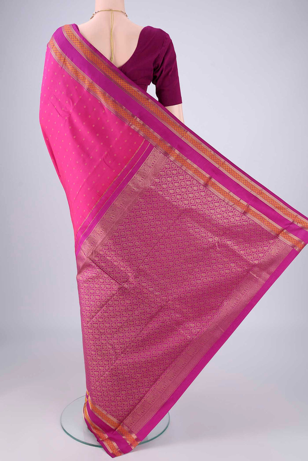 Flat view of Dark Pink Kanchipuram Silk Saree with Zari Butta on the body and Zari Border. 