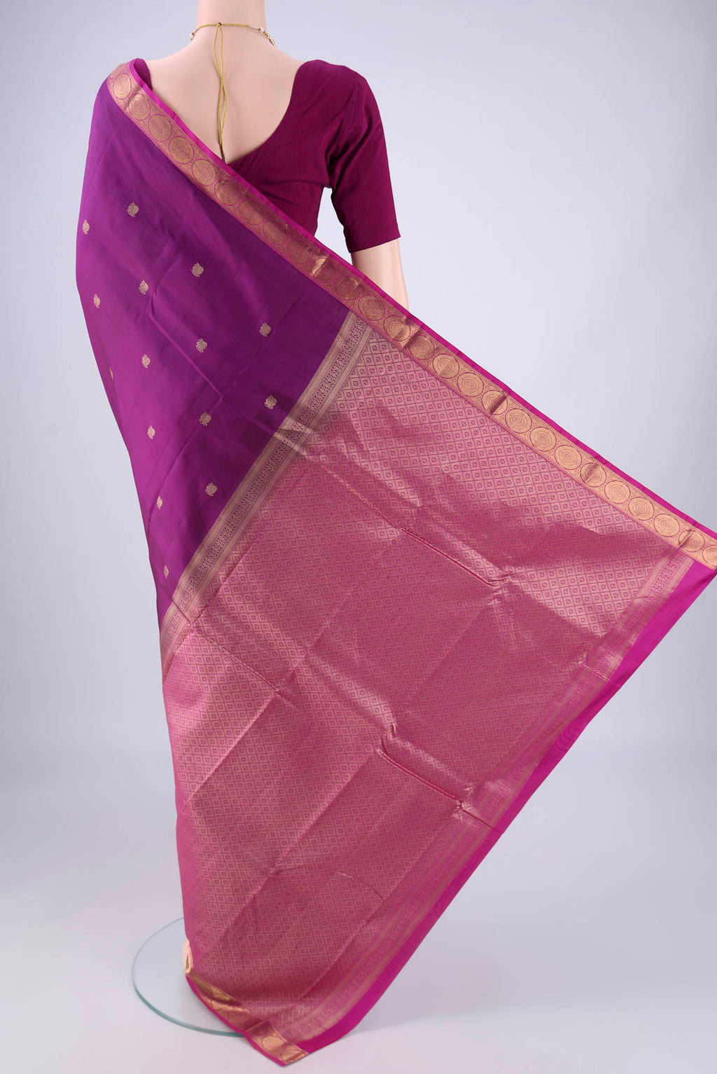 Flat view of Purple Kanjivaram Silk Saree with Zari Butta on the body and Zari Border. 
