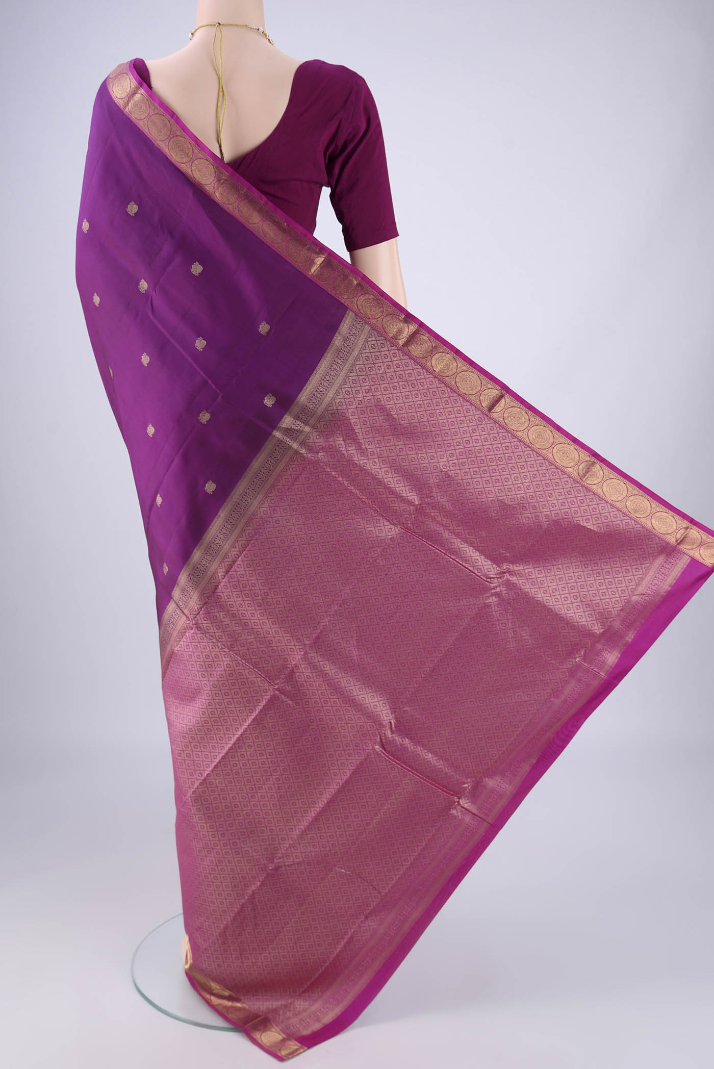 Flat view of Purple Kanjivaram Silk Saree with Zari Butta on the body and Zari Border. 