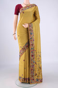 Golden Parsi Embroidery Saree with Embroidery on the body and Embroidery Border.  displayed on a mannequin