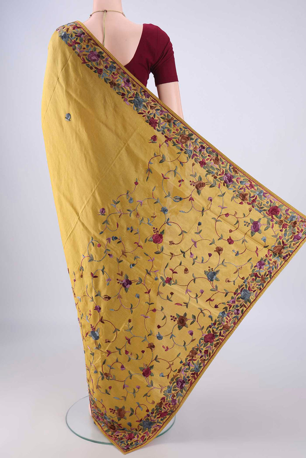 Flat view of Golden Parsi Embroidery Saree with Embroidery on the body and Embroidery Border. 