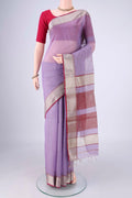Lavender Maheshwari Silk Cotton Saree with Stripes on the body and Zari Border.  displayed on a mannequin