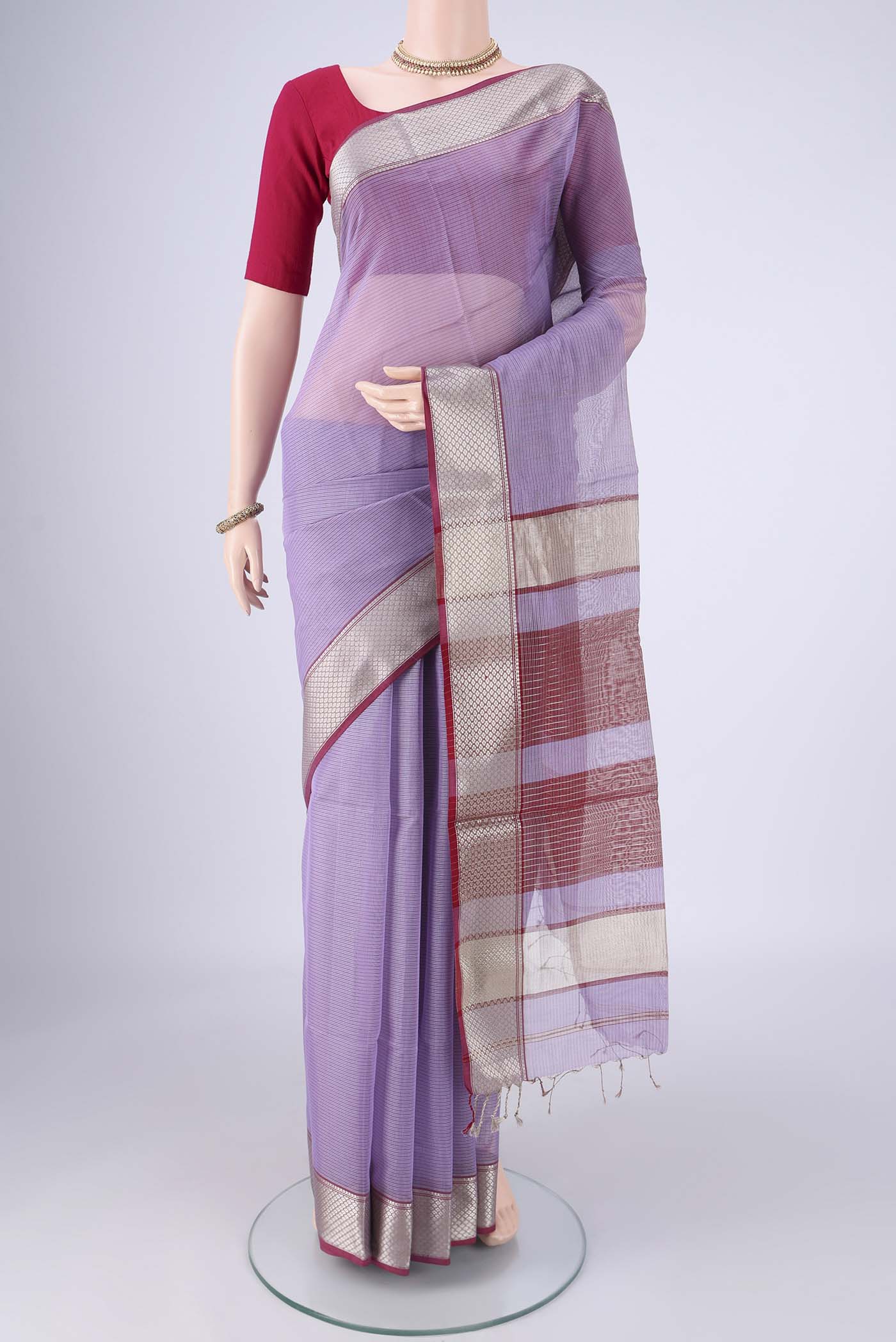 Lavender Maheshwari Silk Cotton Saree with Stripes on the body and Zari Border.  displayed on a mannequin