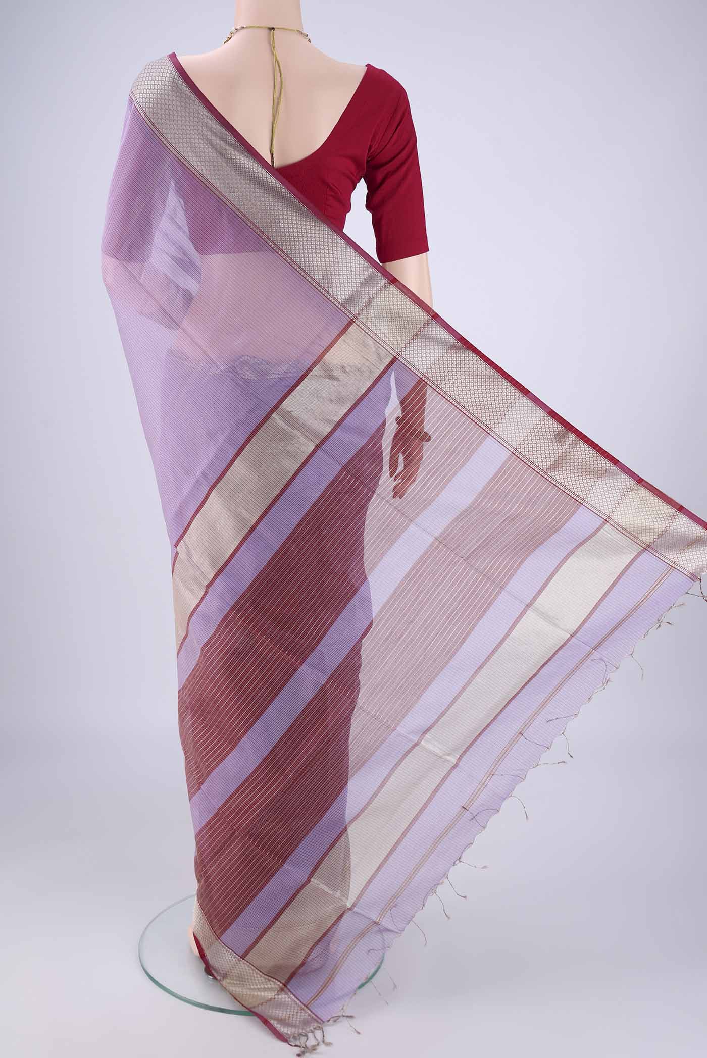 Flat view of Lavender Maheshwari Silk Cotton Saree with Stripes on the body and Zari Border. 