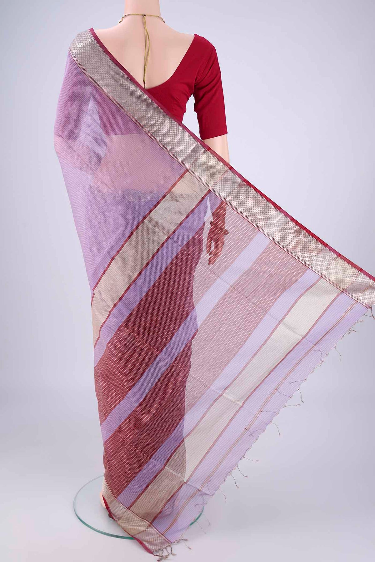 Flat view of Lavender Maheshwari Silk Cotton Saree with Stripes on the body and Zari Border. 