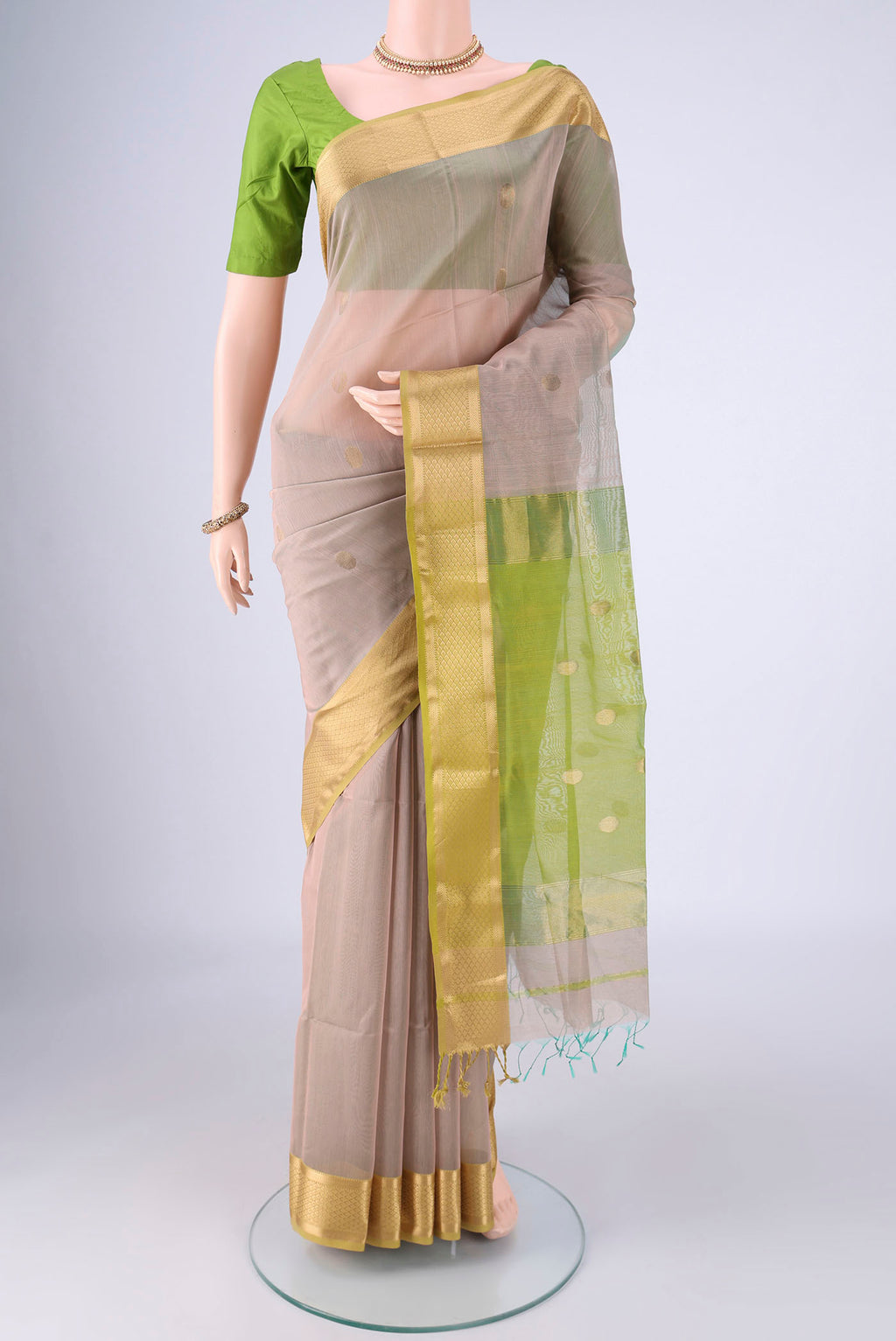 Lilac Maheshwari Silk Cotton Saree with Zari Butta on the body and Zari Border.  displayed on a mannequin