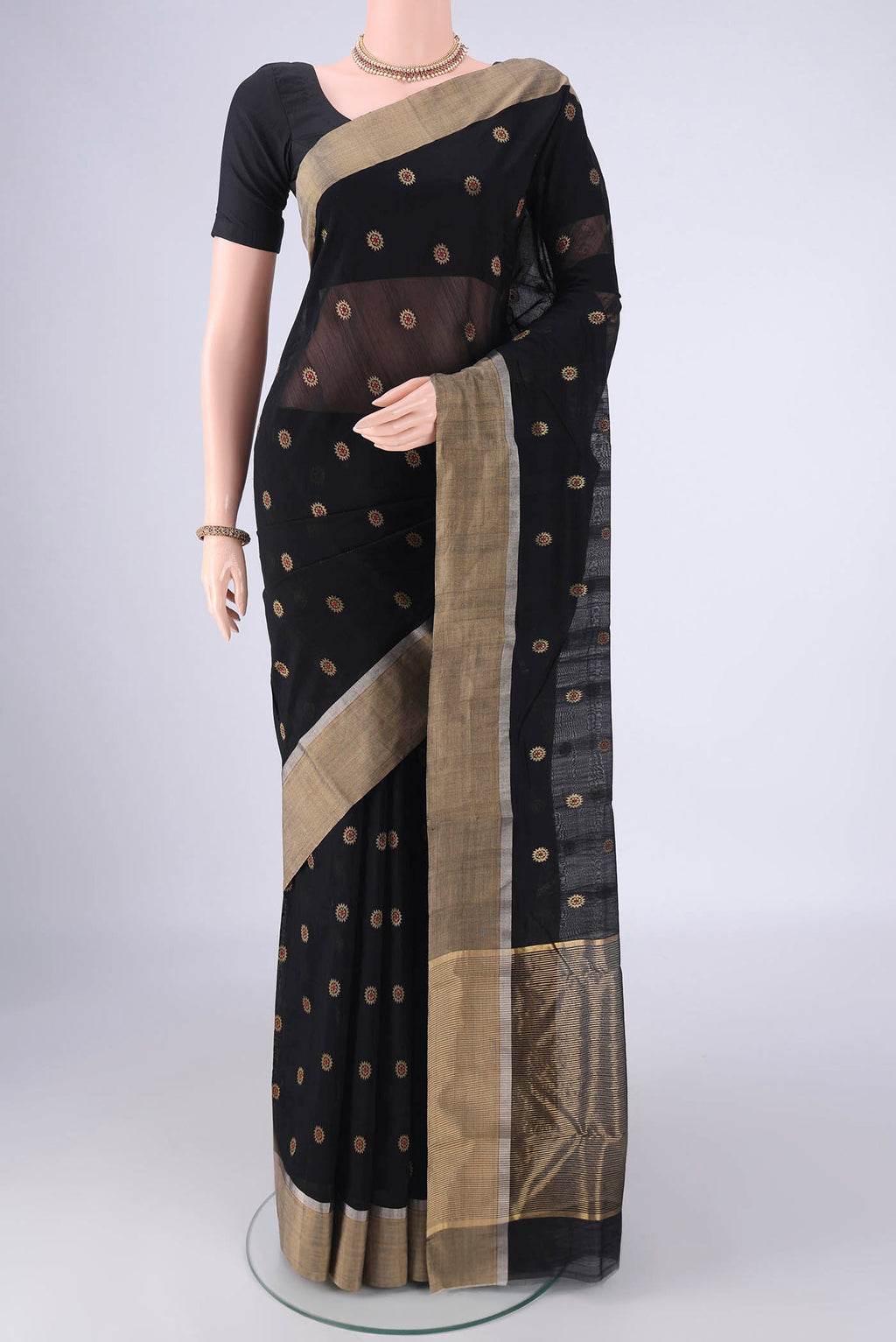 Black Chanderi Silk Cotton Saree with Zari And Thread Butta on the body and Zari Border.  displayed on a mannequin