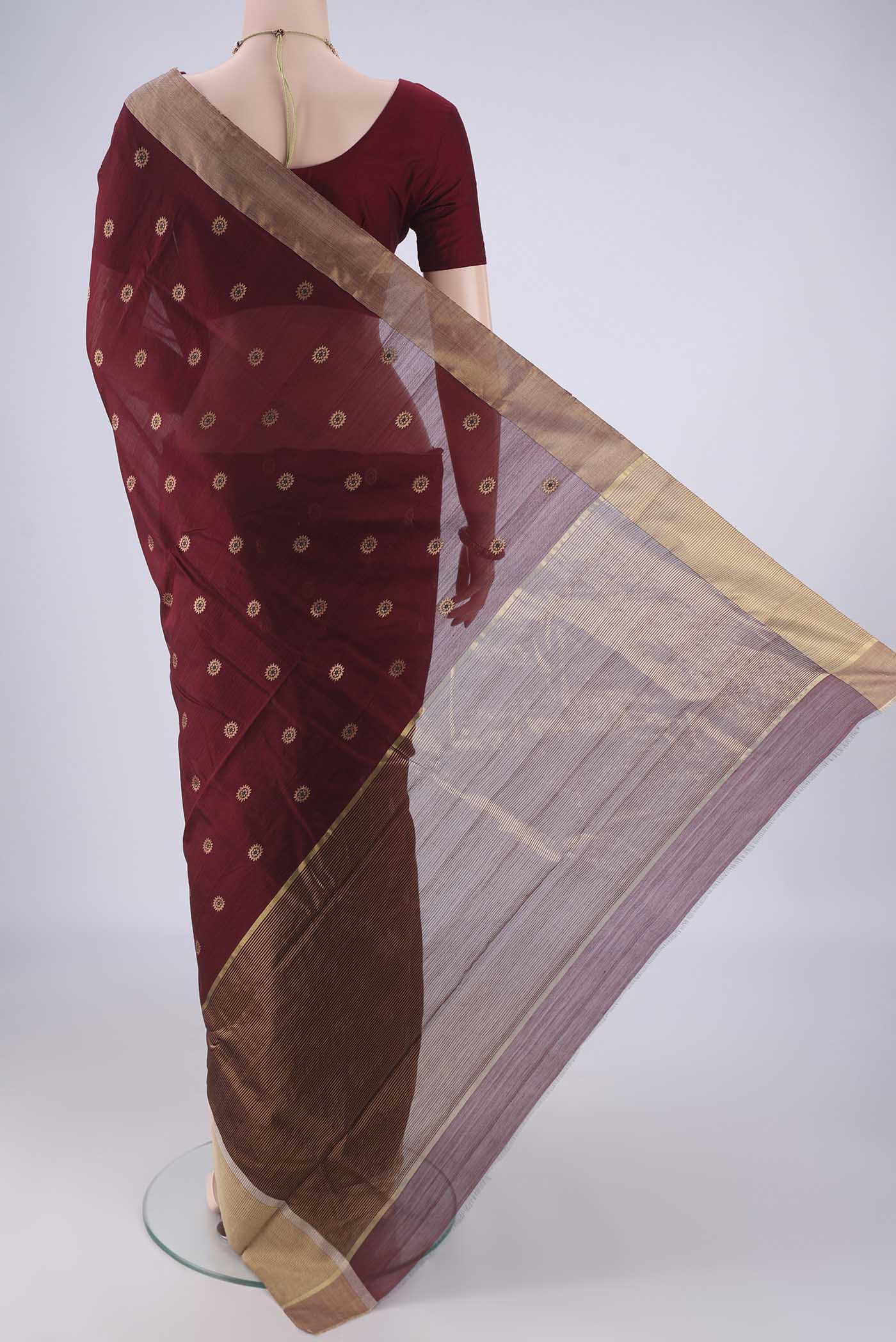 Flat view of Coffee Brown Chanderi Silk Cotton Saree with Zari And Thread Butta on the body and Zari Border. 