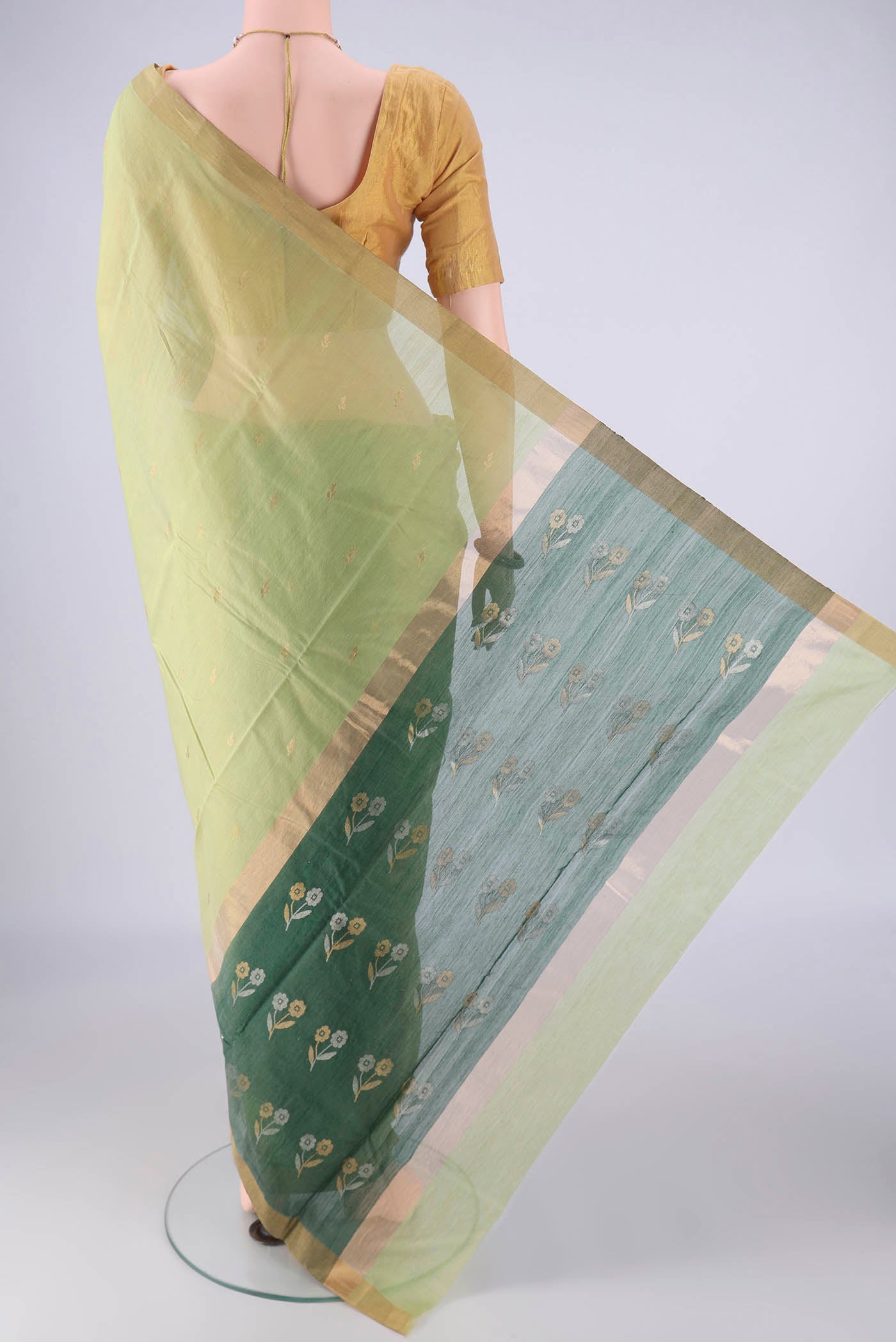 Flat view of Light Green Chanderi Silk Cotton Saree with Zari Butta on the body and Zari Border. 