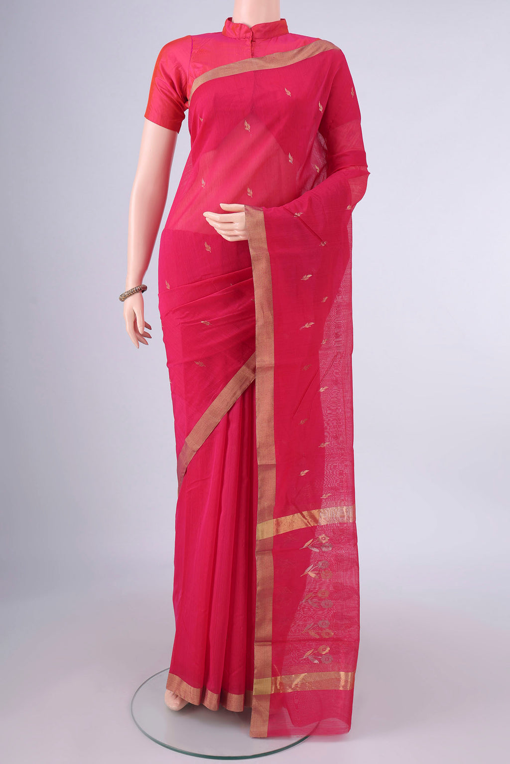Dark Pink Chanderi Cotton Saree with Zari Butta on the body and Zari Border.  displayed on a mannequin
