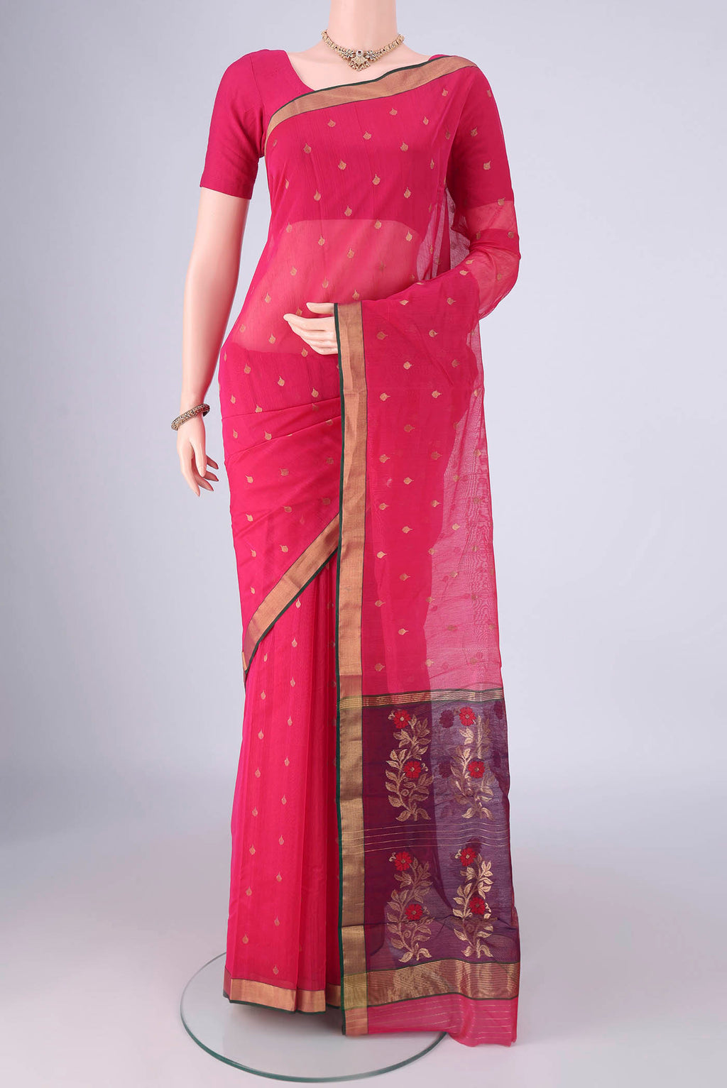 Rani Pink Chanderi Silk Cotton Saree with Zari Butta on the body and Zari Border.  displayed on a mannequin