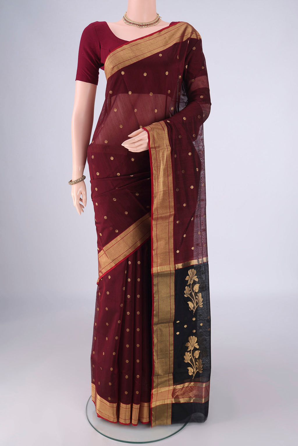 Coffee Brown Chanderi Silk Cotton Saree with Zari Butta on the body and Zari Border.  displayed on a mannequin
