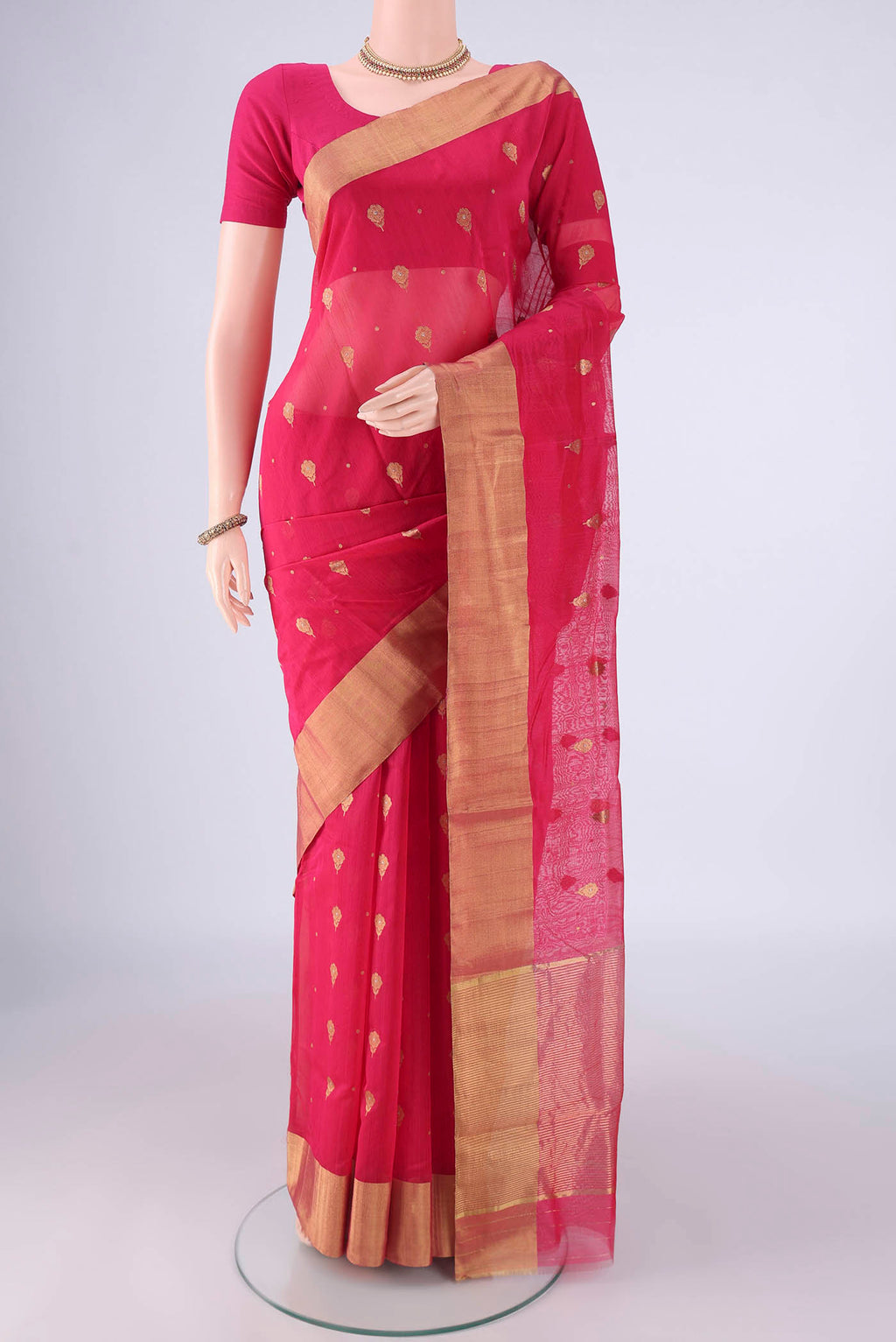 Dark Pink Chanderi Silk Saree with Zari Butta on the body and Zari And Thread Border.  displayed on a mannequin