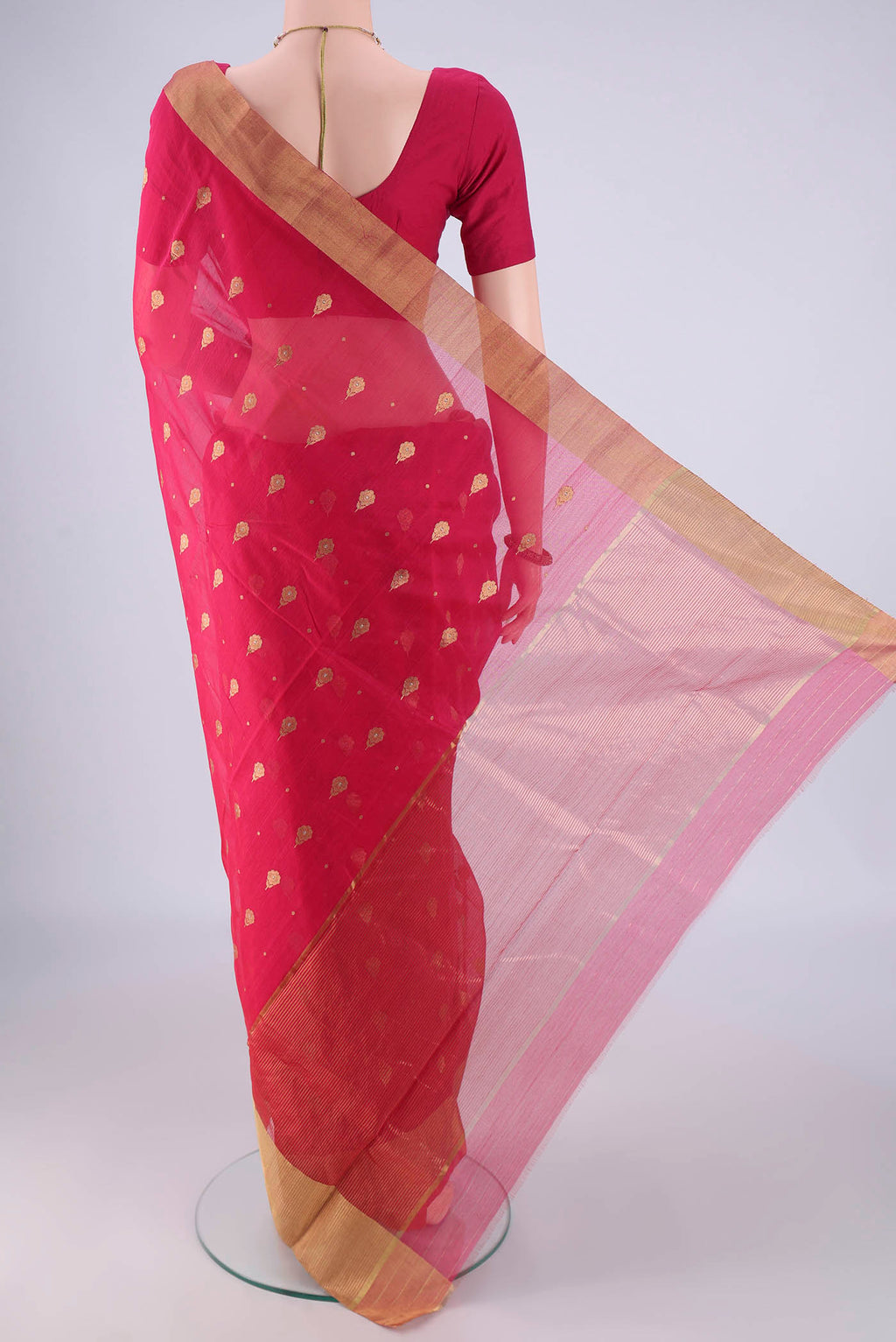 Flat view of Dark Pink Chanderi Silk Saree with Zari Butta on the body and Zari And Thread Border. 