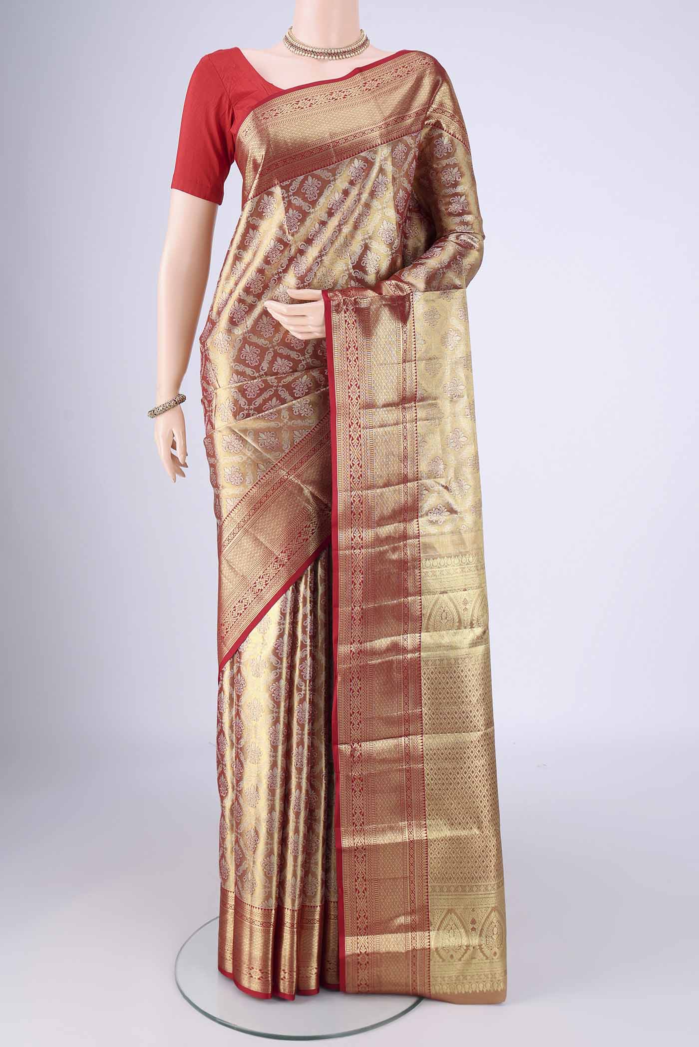 Golden Dual Tone Kanjivaram Tissue Silk Saree with Zari Brocade on the body and Zari Border.  displayed on a mannequin