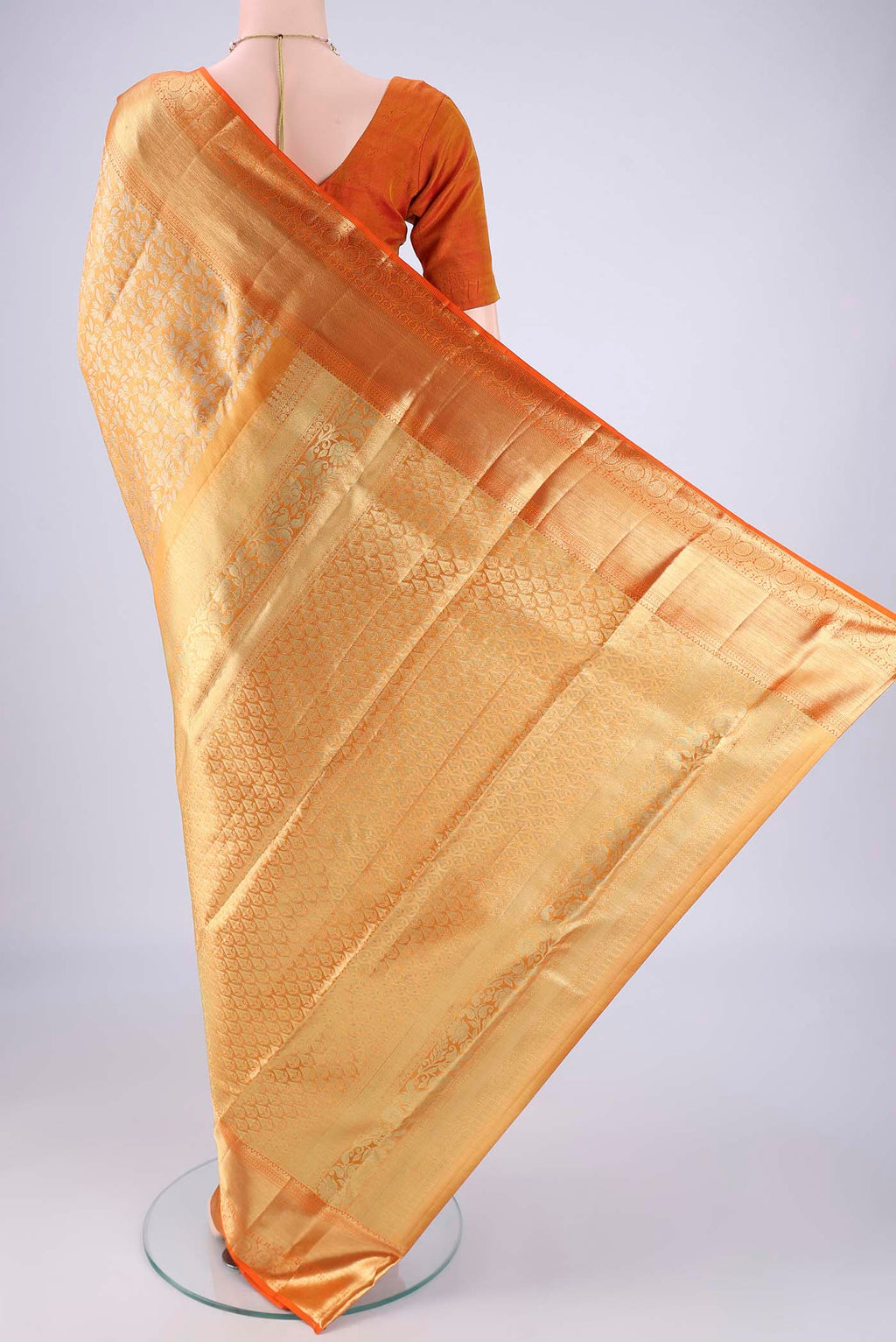 Flat view of Golden Dual Tone Kanjivaram Tissue Silk Saree with Zari Brocade on the body and Zari Border. 