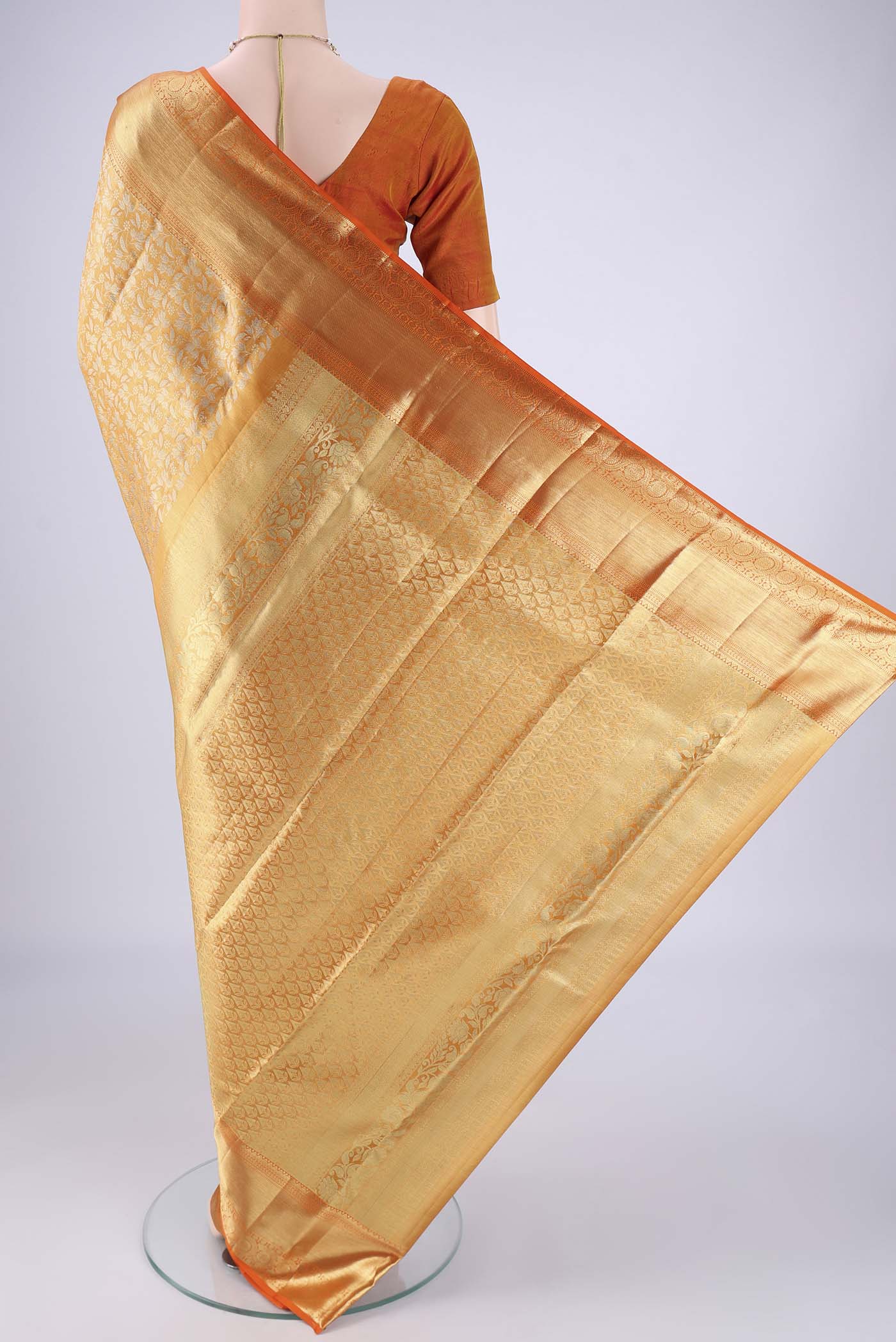 Flat view of Golden Dual Tone Kanjivaram Tissue Silk Saree with Zari Brocade on the body and Zari Border. 