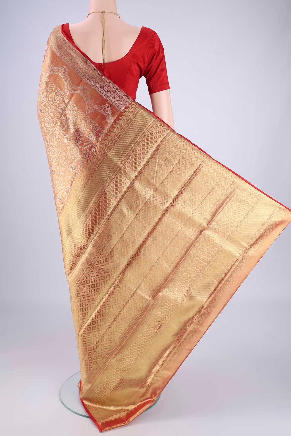 Flat view of Gold with Red Color Kanjivaram Tissue Silk Saree with Zari Brocade on the body and Zari Border. 