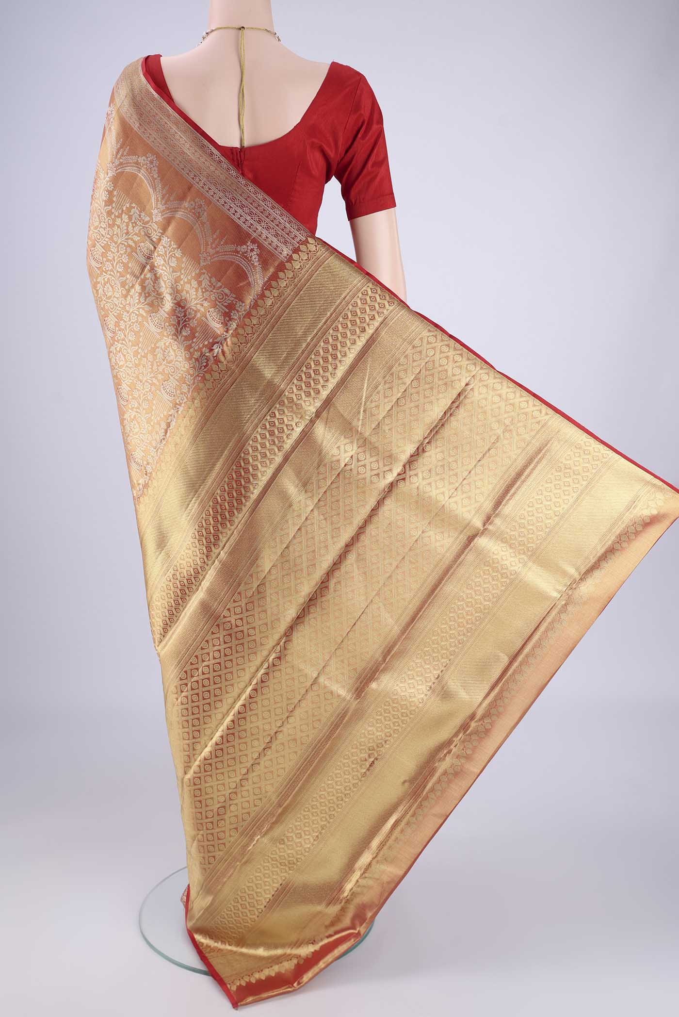 Flat view of Gold with Red Color Kanjivaram Tissue Silk Saree with Zari Brocade on the body and Zari Border. 
