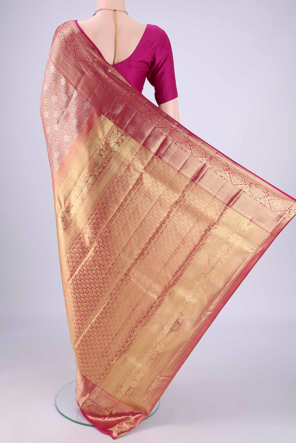 Flat view of Rose Gold Dual Tone Kanjivaram Tissue Silk Saree with Zari Brocade on the body and Zari Border. 