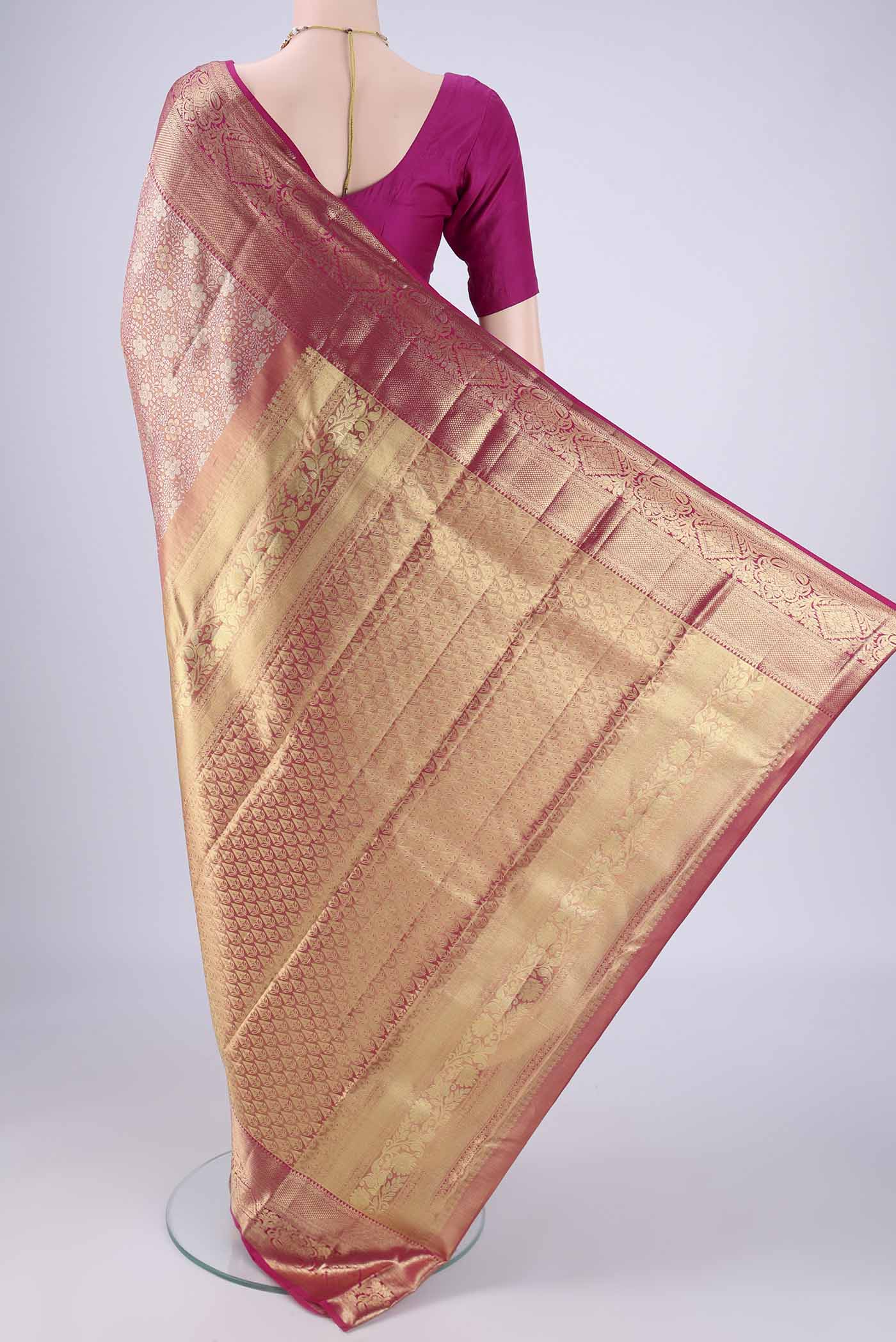 Flat view of Rose Gold Dual Tone Kanjivaram Tissue Silk Saree with Zari Brocade on the body and Zari Border. 