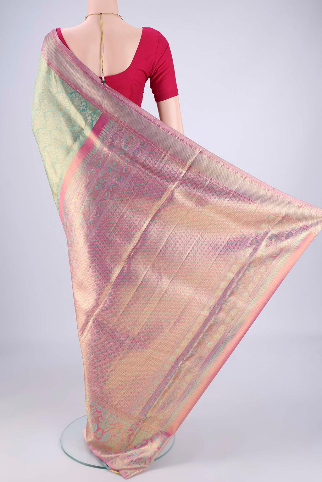 Flat view of Sea Green Dual Tone Kanchipuram Tissue Silk Saree with Zari Brocade on the body and Zari Border. 