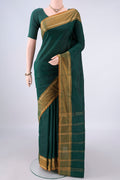 Bottle Green Blended Bangalore Silk Saree with Plain Body and Zari Border.  displayed on a mannequin
