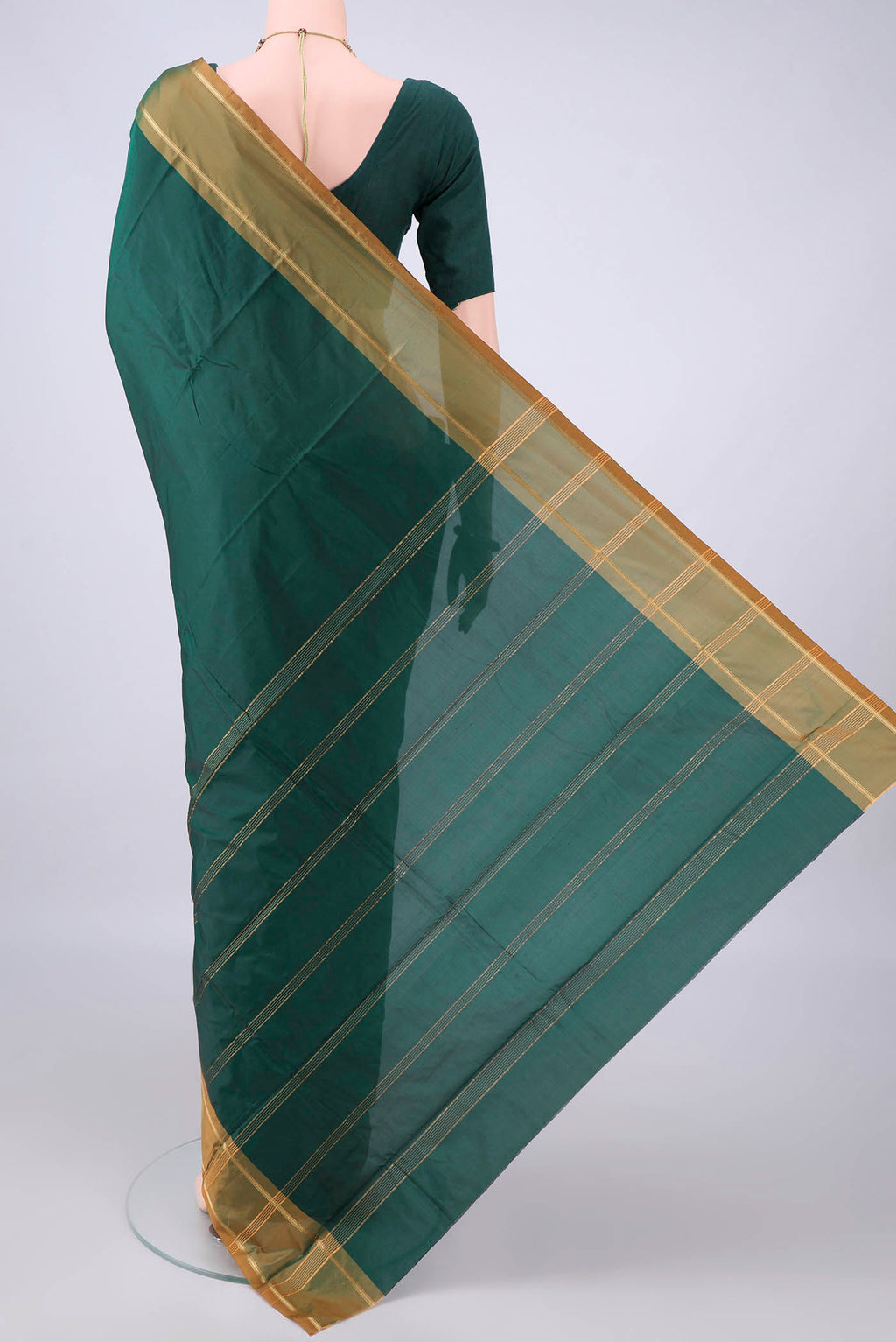 Flat view of Bottle Green Blended Bangalore Silk Saree with Plain Body and Zari Border. 