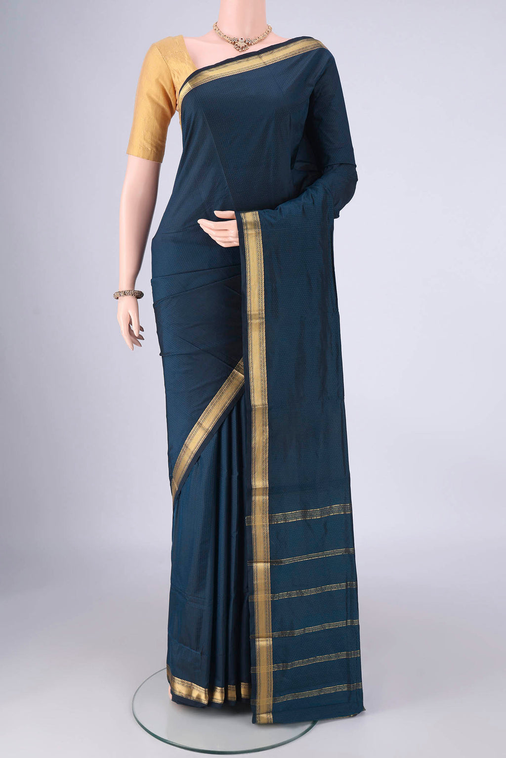 Blue Blended Bangalore Silk Saree with Jacquard design on the body and Zari Border.  displayed on a mannequin