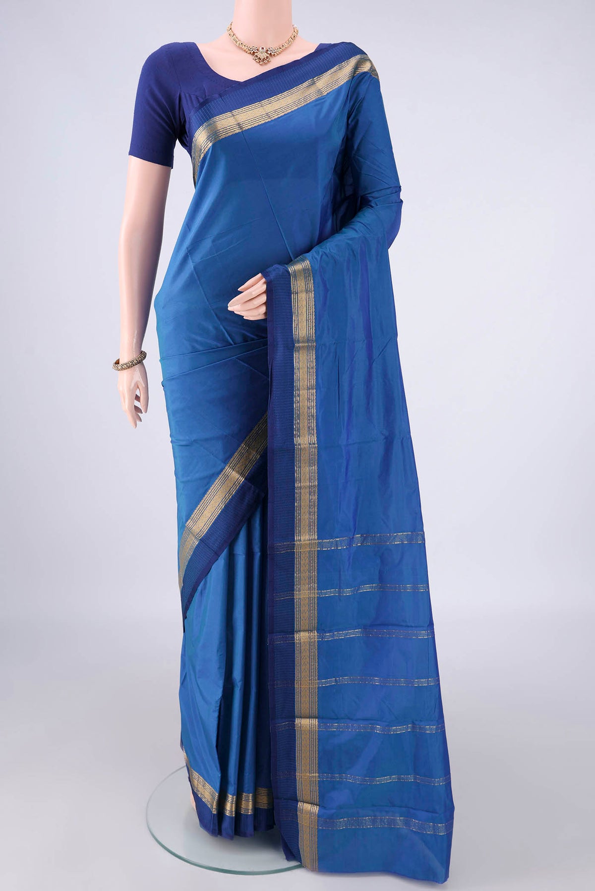 Blue Blended Bangalore Silk Saree with Plain Body and Zari And Thread Border.  displayed on a mannequin