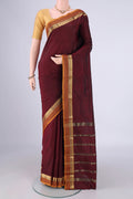 Maroon Blended Bangalore Silk Saree with Plain Body and Zari Border.  displayed on a mannequin