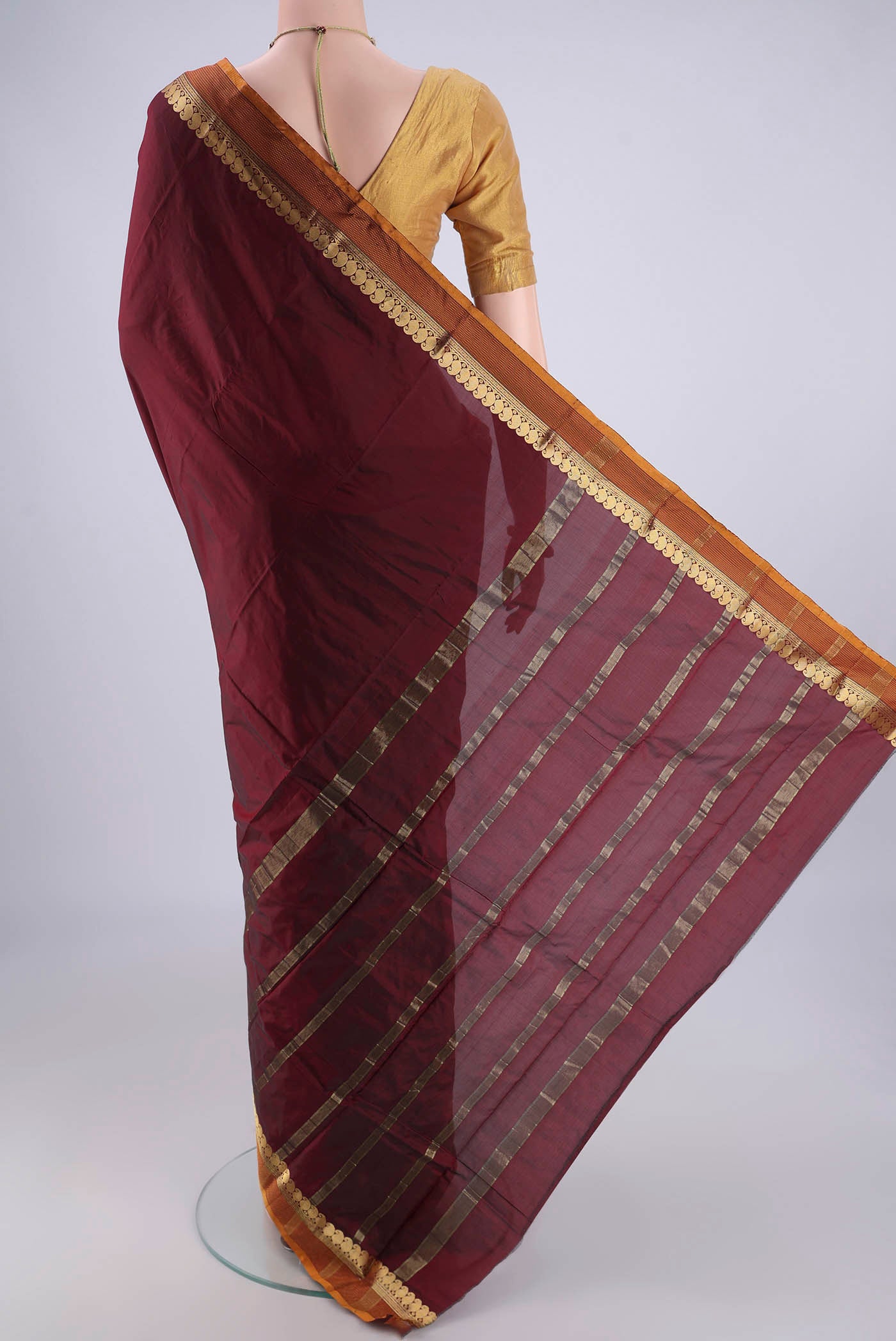 Flat view of Maroon Blended Bangalore Silk Saree with Plain Body and Zari Border. 