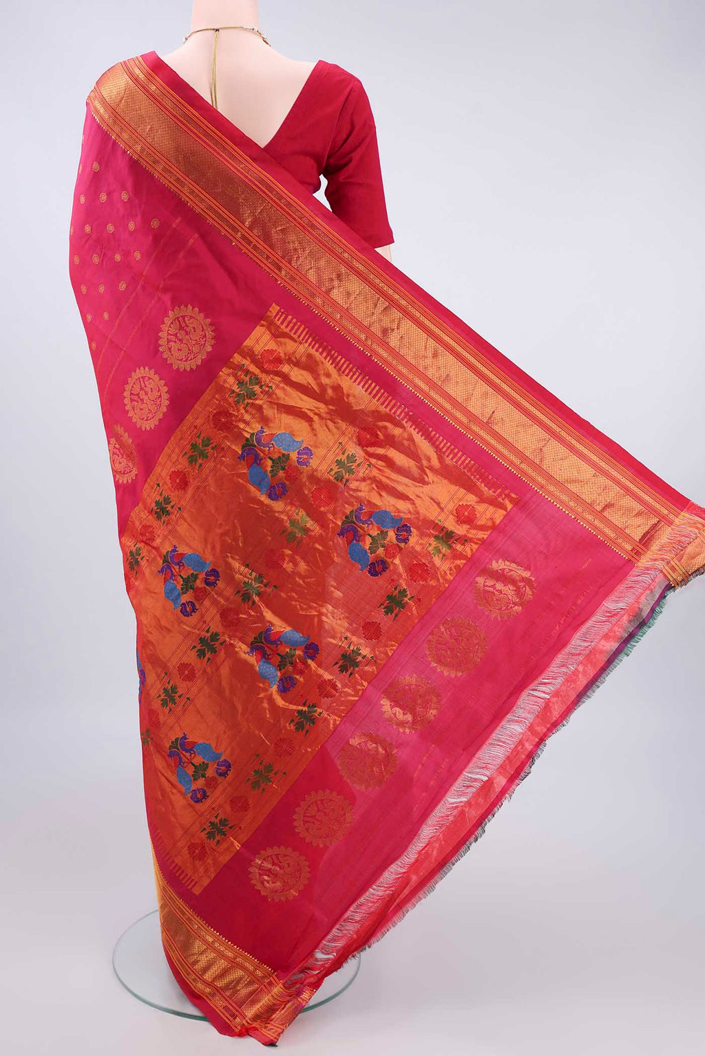 Flat view of Pure Silk Coral Gadwal Saree with Zari Butta on the body and Zari Border. 