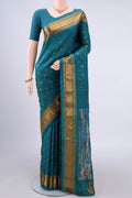 Pure Silk Turquoise Gadwal Saree with Zari Butta on the body and Zari Border.  displayed on a mannequin