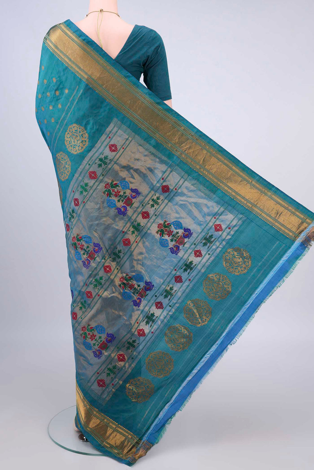 Flat view of Pure Silk Turquoise Gadwal Saree with Zari Butta on the body and Zari Border. 