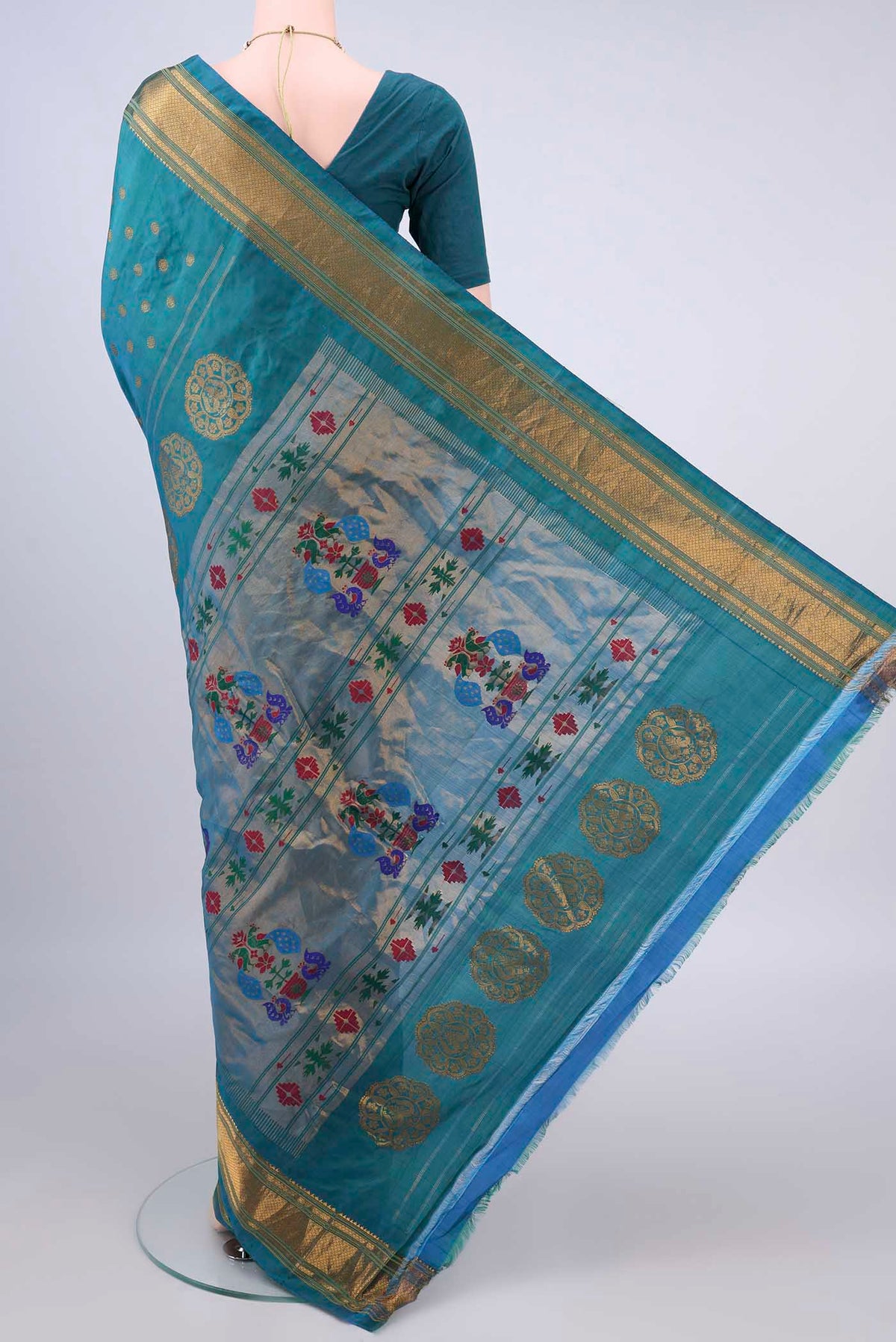 Flat view of Pure Silk Turquoise Gadwal Saree with Zari Butta on the body and Zari Border. 