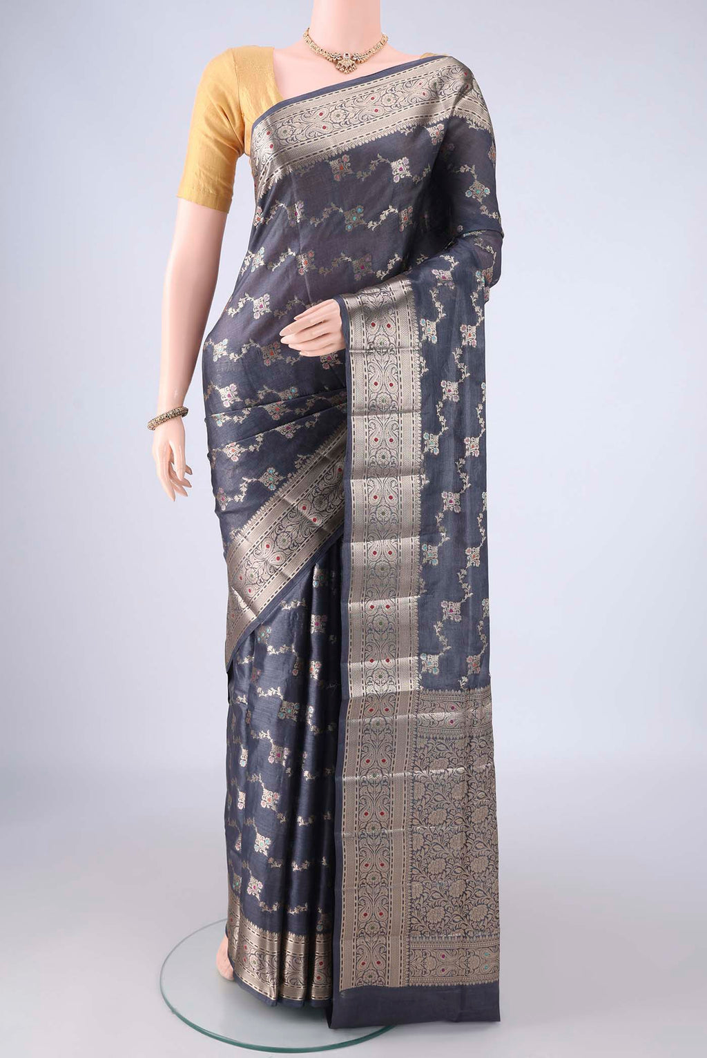 Grey Banarasi Tussar Silk Saree with Zari Brocade on the body and Zari Border.  displayed on a mannequin