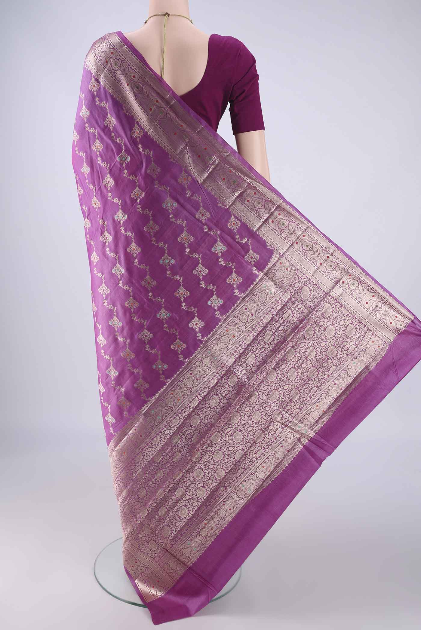 Flat view of Magenta Banarasi Tussar Silk Saree with Zari And Thread Butta on the body and Zari Border. 