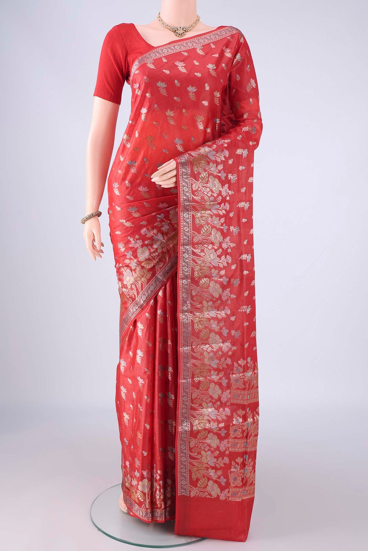 Imperial Red Banarasi Tussar Silk Saree with Zari And Thread Butta on the body and Zari Border.  displayed on a mannequin