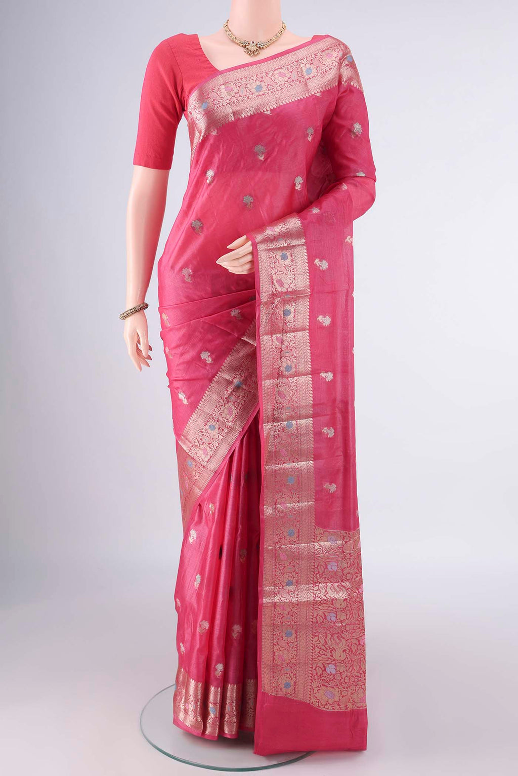 Rani Pink Banarasi Tussar Saree with Zari And Thread Butta on the body and Zari And Thread Border.  displayed on a mannequin