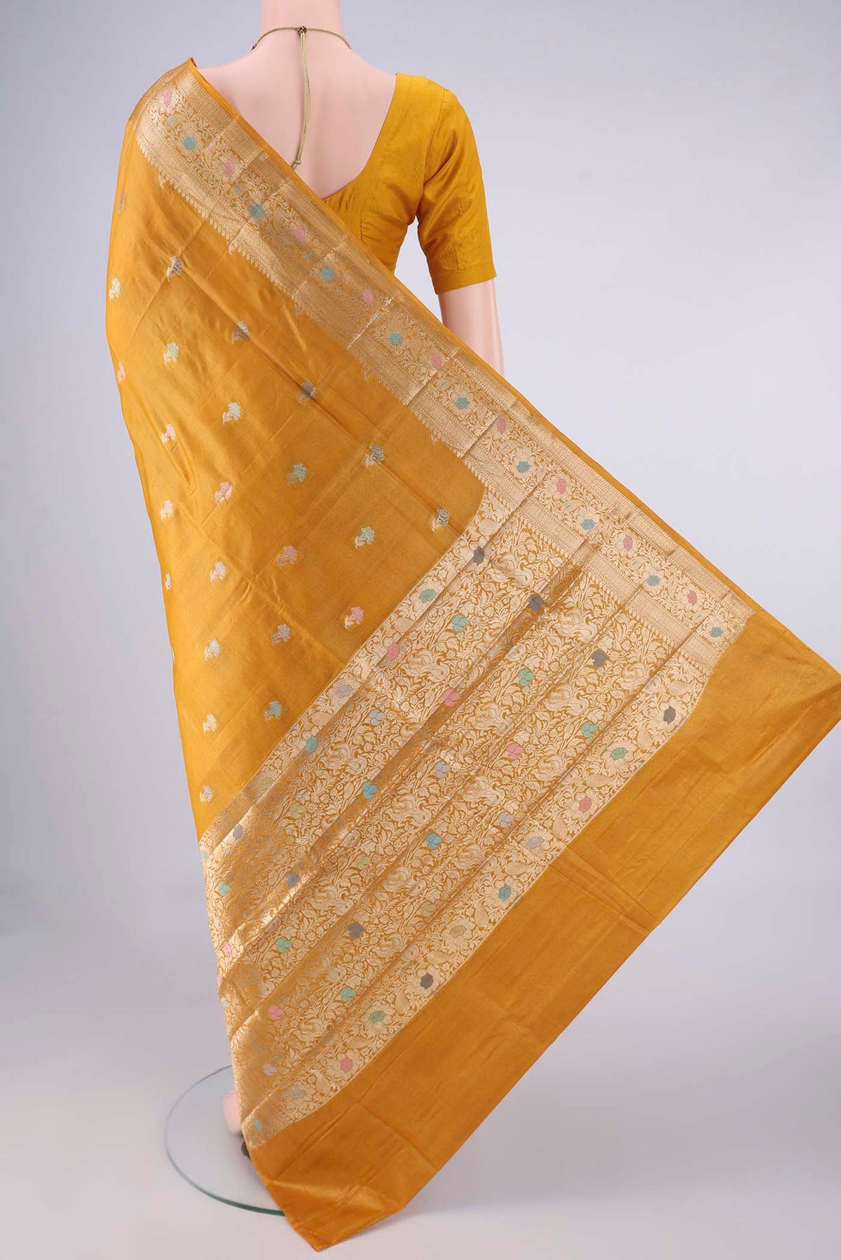 Flat view of Mustard Banarasi Tussar Saree with Zari And Thread Butta on the body and Zari And Thread Border. 