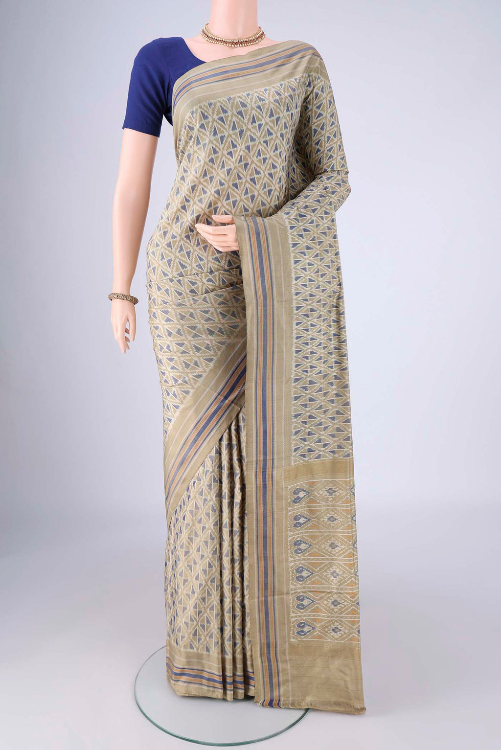 Sage Green Pochampally Silk Saree with Pure Ikat on the body and Plain Border.  displayed on a mannequin