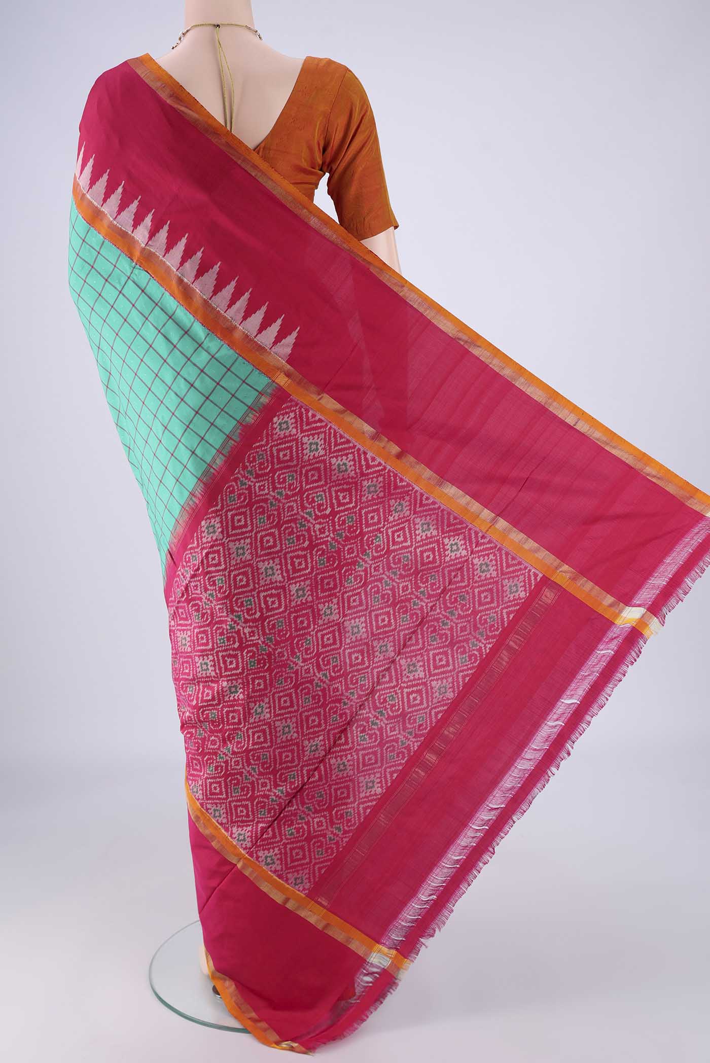 Flat view of Sea Green Pochampally Silk Saree with Checked design on the body and Temple Border. 