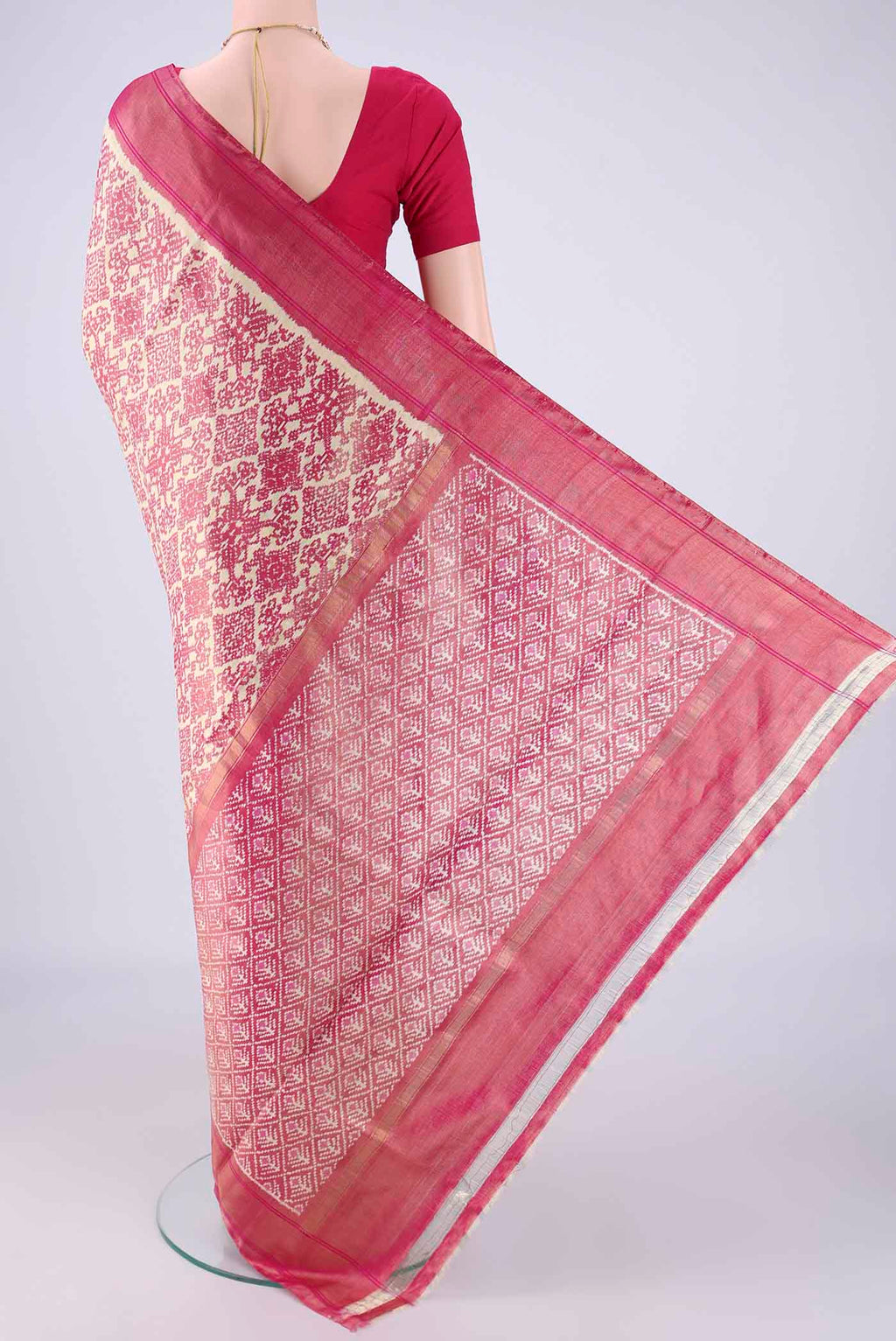 Flat view of Off White Pochampally Silk Saree with Ikat design on the body and Zari Border. 