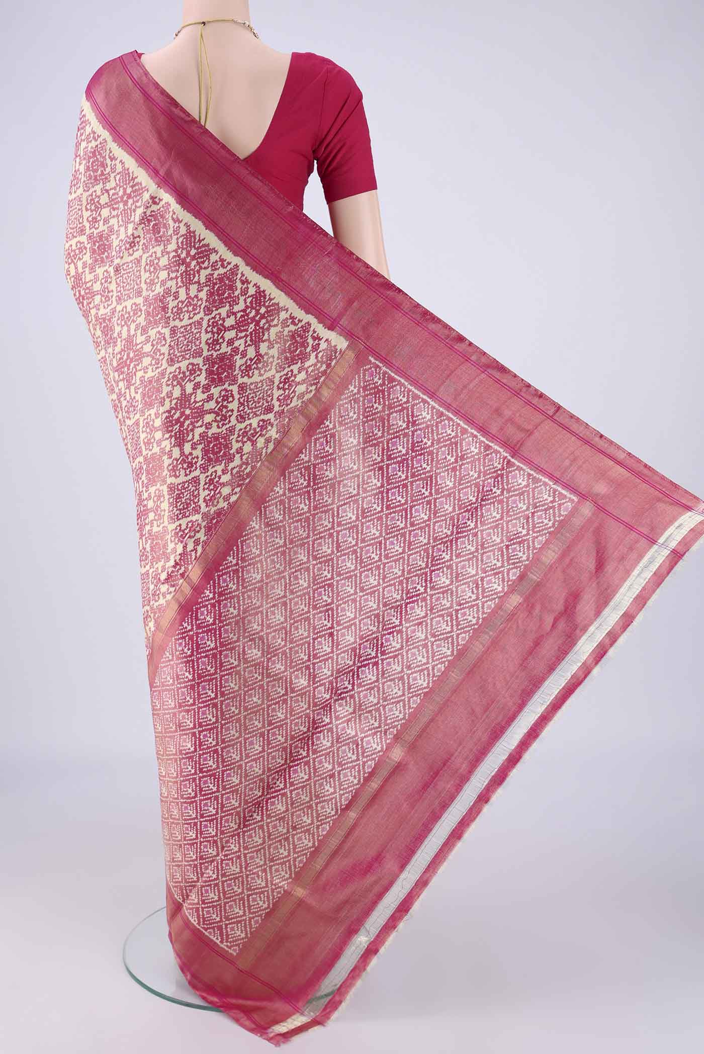Flat view of Off White Pochampally Silk Saree with Ikat design on the body and Zari Border. 