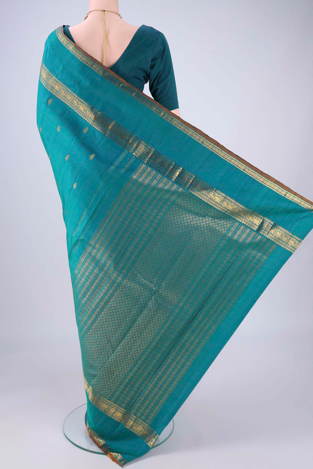 Flat view of Sea Green Kanjivaram Silk Saree with Zari Butta on the body and Zari Border. 